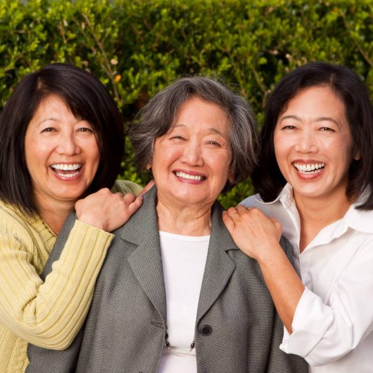 Asian mom with her adult daughters